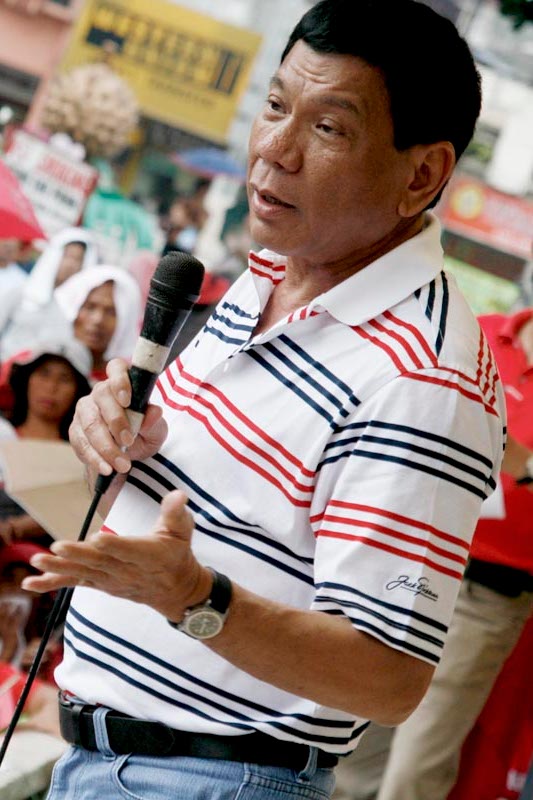 Davao City Mayor Rodrigo Duterte speaks before the protesting residents in the city who are calling for the moratorium on housing foreclosure in several housing projects in the city. At least 5,000 homeowners coming from different subdivisions in the city and even from neighboring towns and cities marched around the city on Wednesday afternoon, Feburary 11, 2008 to oppose the transfer of an estimated P13 billion worth of housing loans with the National Home Mortgage Finance Corporation (NHMFC) to a private entity known as Balikatan Housing Finance Inc. (BHFI). AKP Images / Keith Bacongco