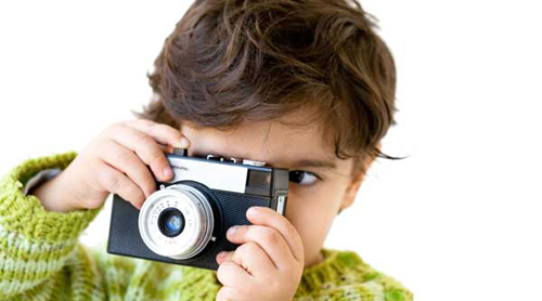 kid-taking-photos-with-cheap-digital-camera